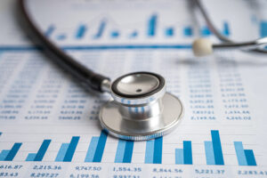 stethoscope on chart and graph paper | 8 Proven Strategies to Streamline Revenue Cycle Management in Your Practice